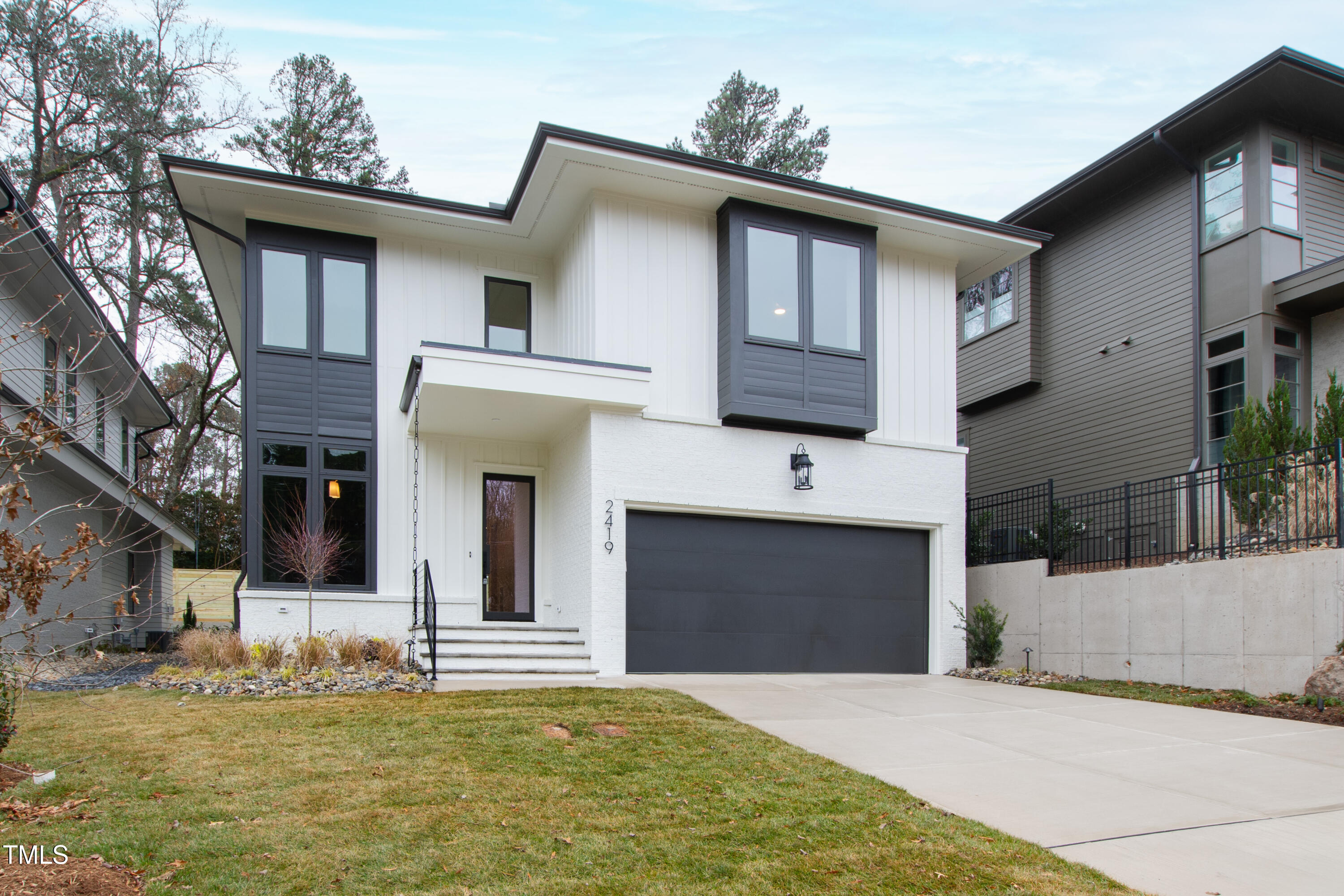 2419 Mayview Road Raleigh, NC 27607 - Photo 55 of 55 a large white building with a outdoor space