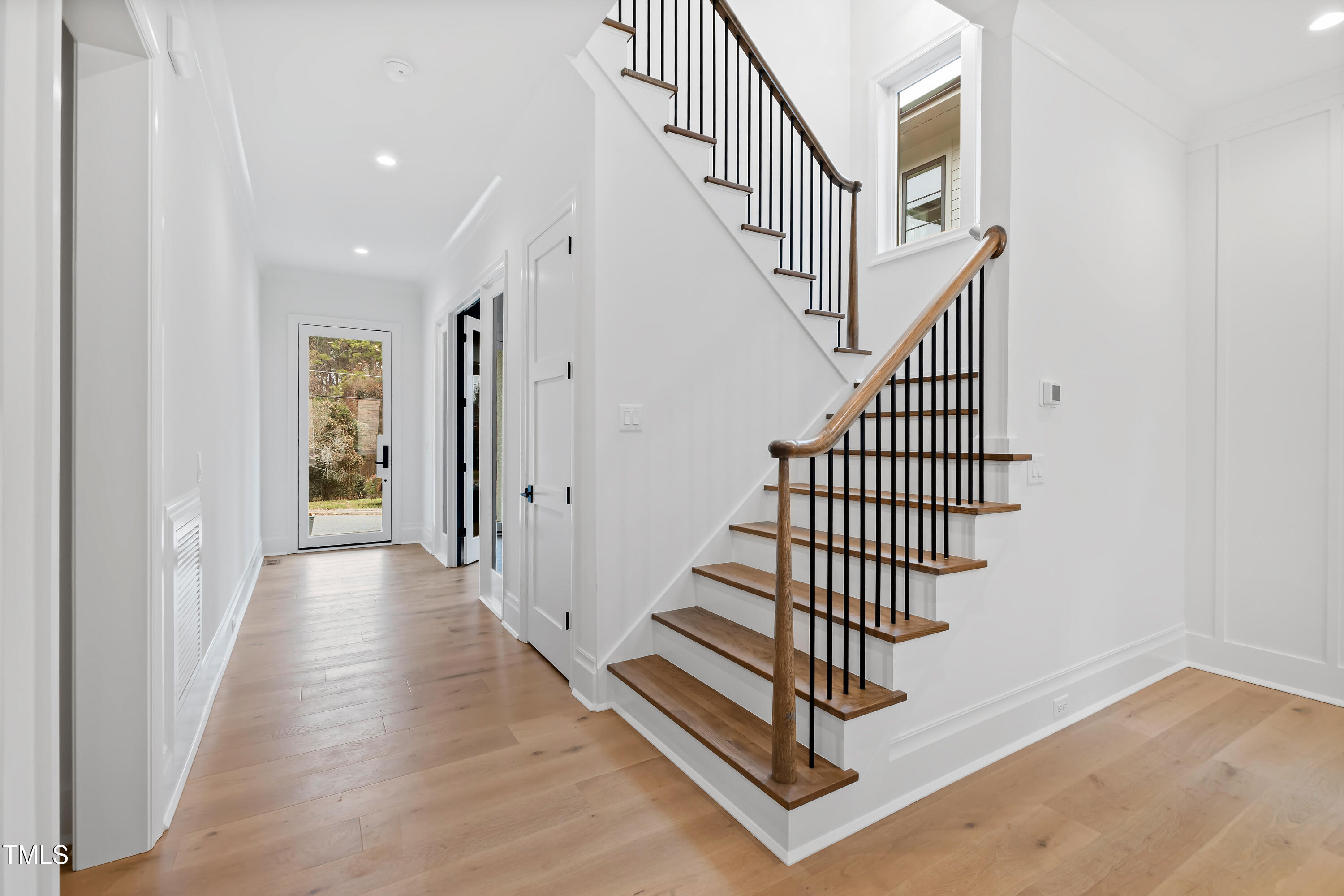 2419 Mayview Road Raleigh, NC 27607 - Photo 7 of 55 a view of a hallway with staircase