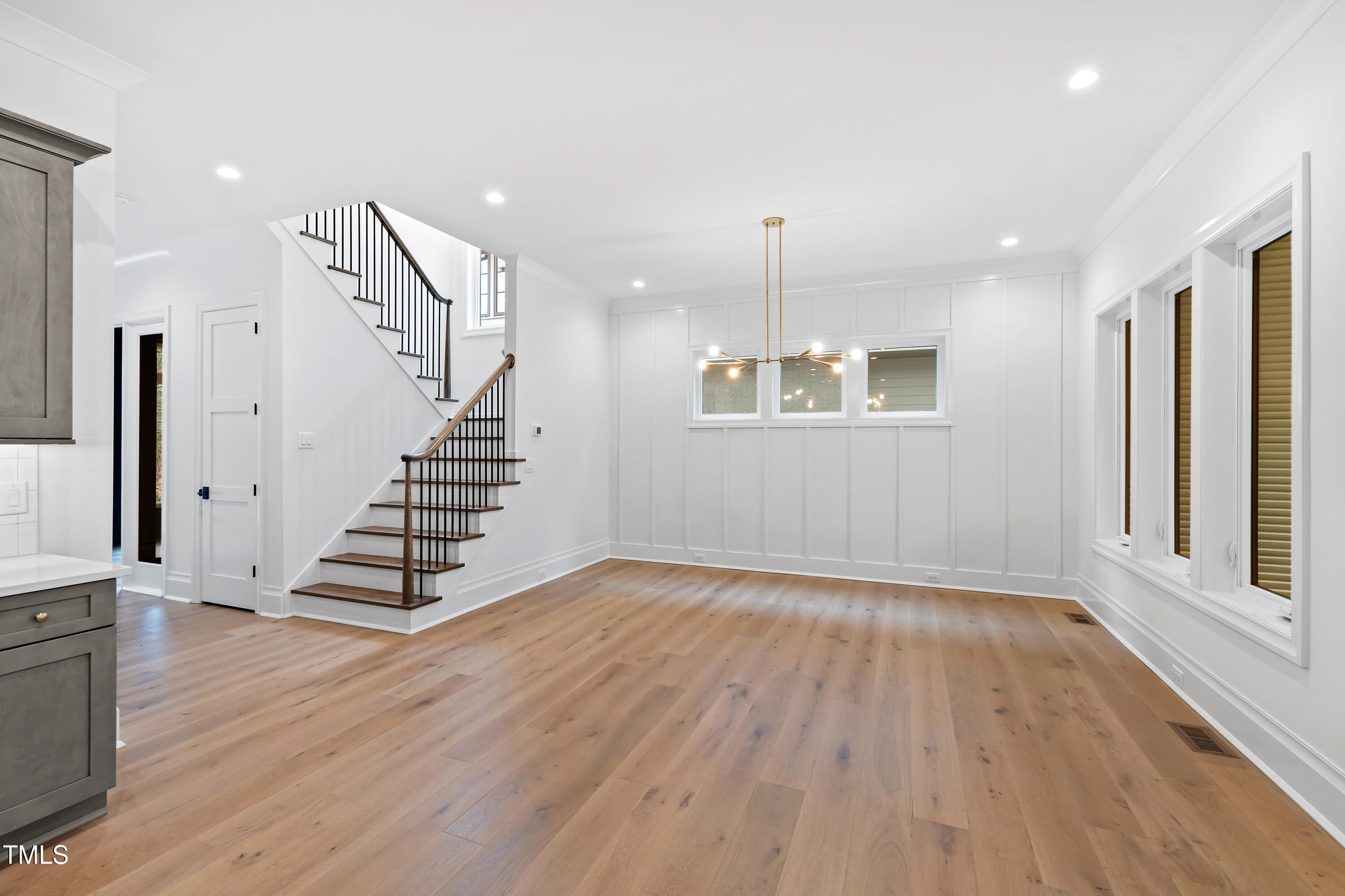2419 Mayview Road Raleigh, NC 27607 - Photo 8 of 55 an empty room with wooden floor and windows
