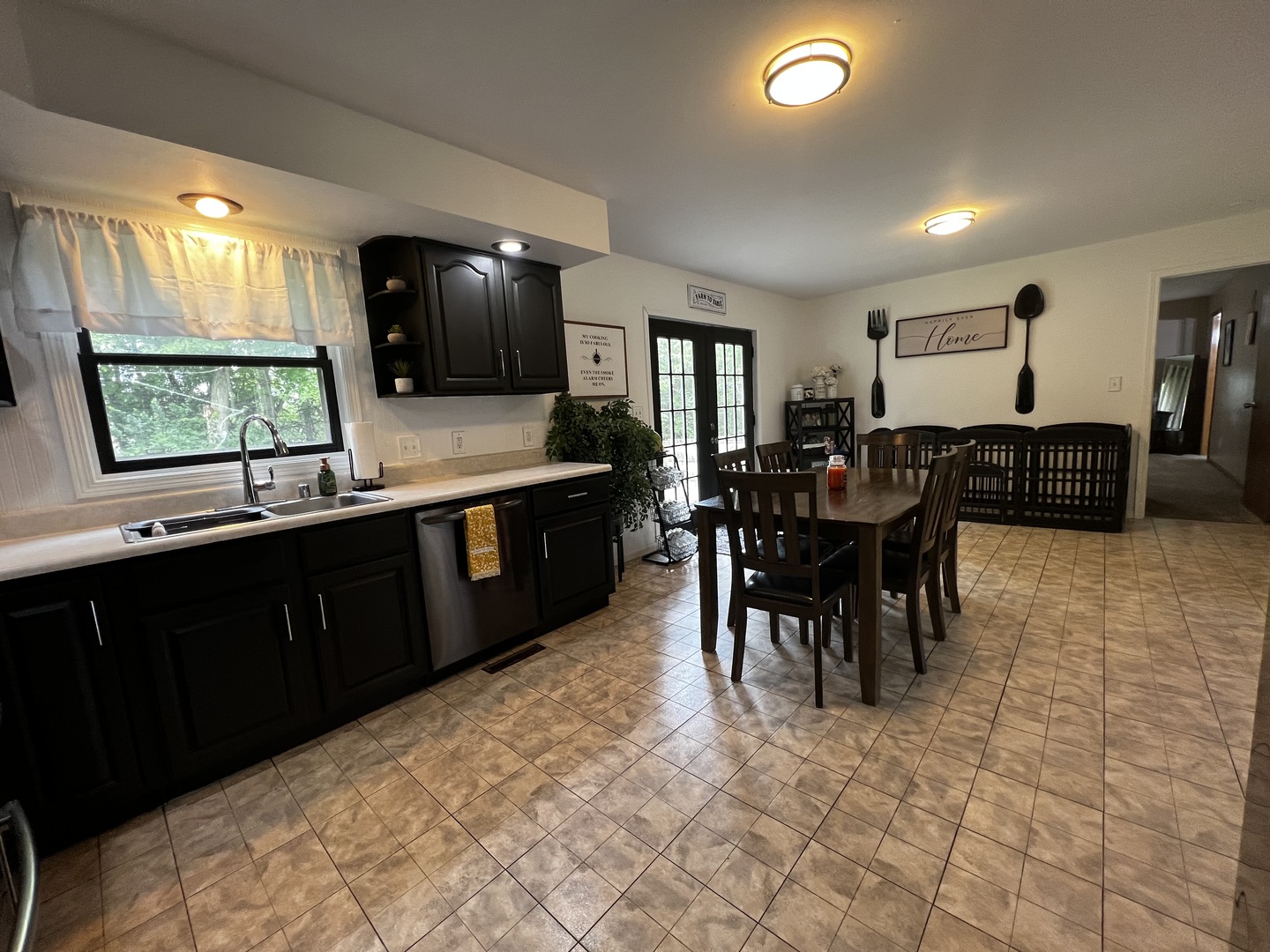 303 Minnesota Drive Dixon, IL 61021 - Photo 11 of 34 a kitchen with stainless steel appliances granite countertop a sink counter space and a window