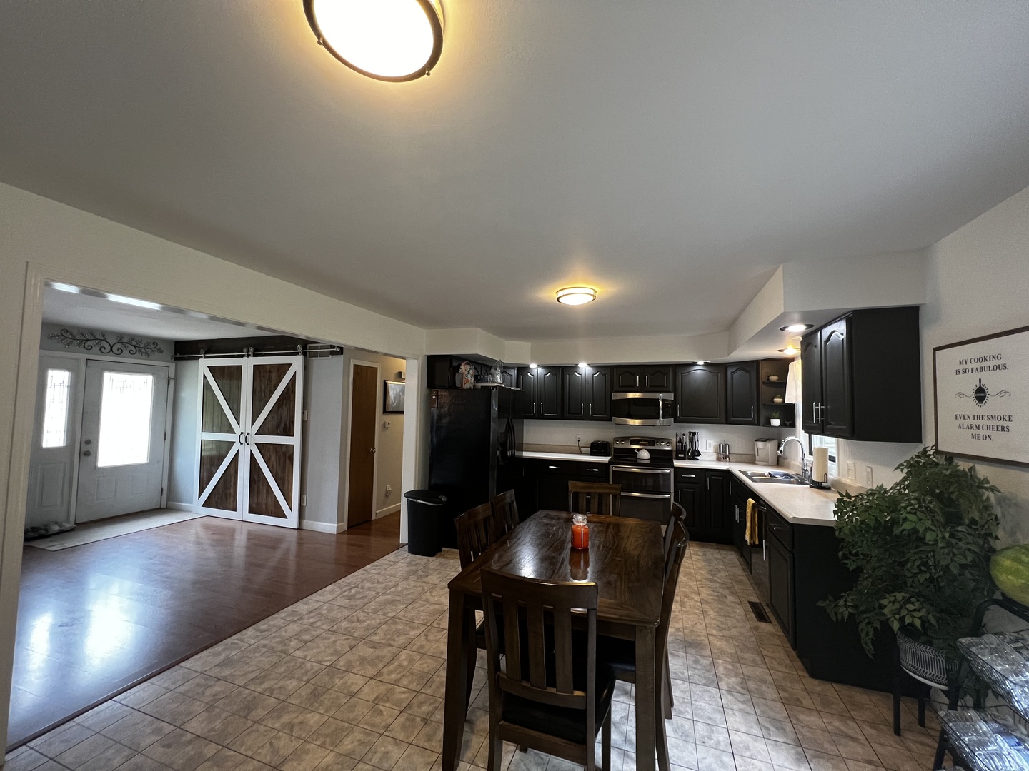 303 Minnesota Drive Dixon, IL 61021 - Photo 15 of 34 a kitchen with kitchen island a dining table and chairs