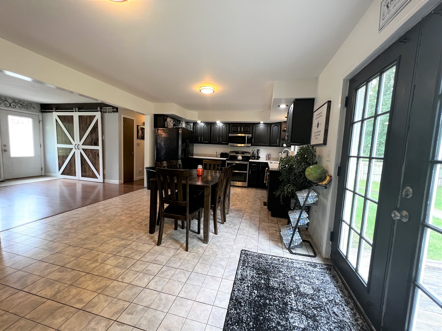 303 Minnesota Drive Dixon, IL 61021 - Photo 18 of 34 a view of a dining room with furniture window and wooden floor