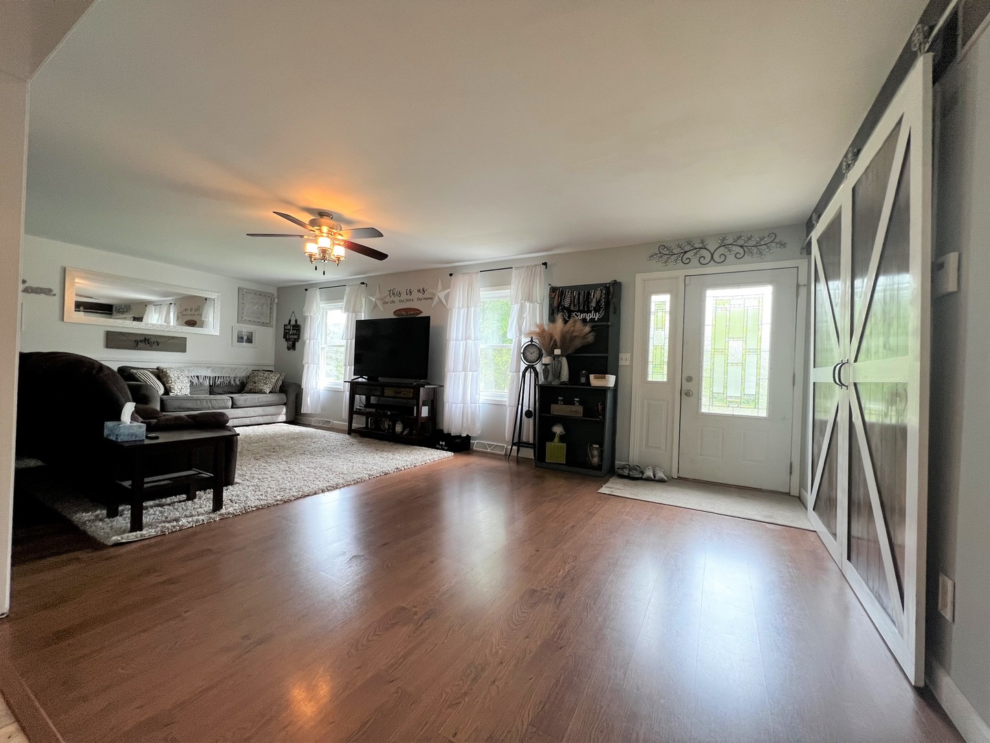 303 Minnesota Drive Dixon, IL 61021 - Photo 2 of 34 a view of a livingroom with furniture and a flat screen tv