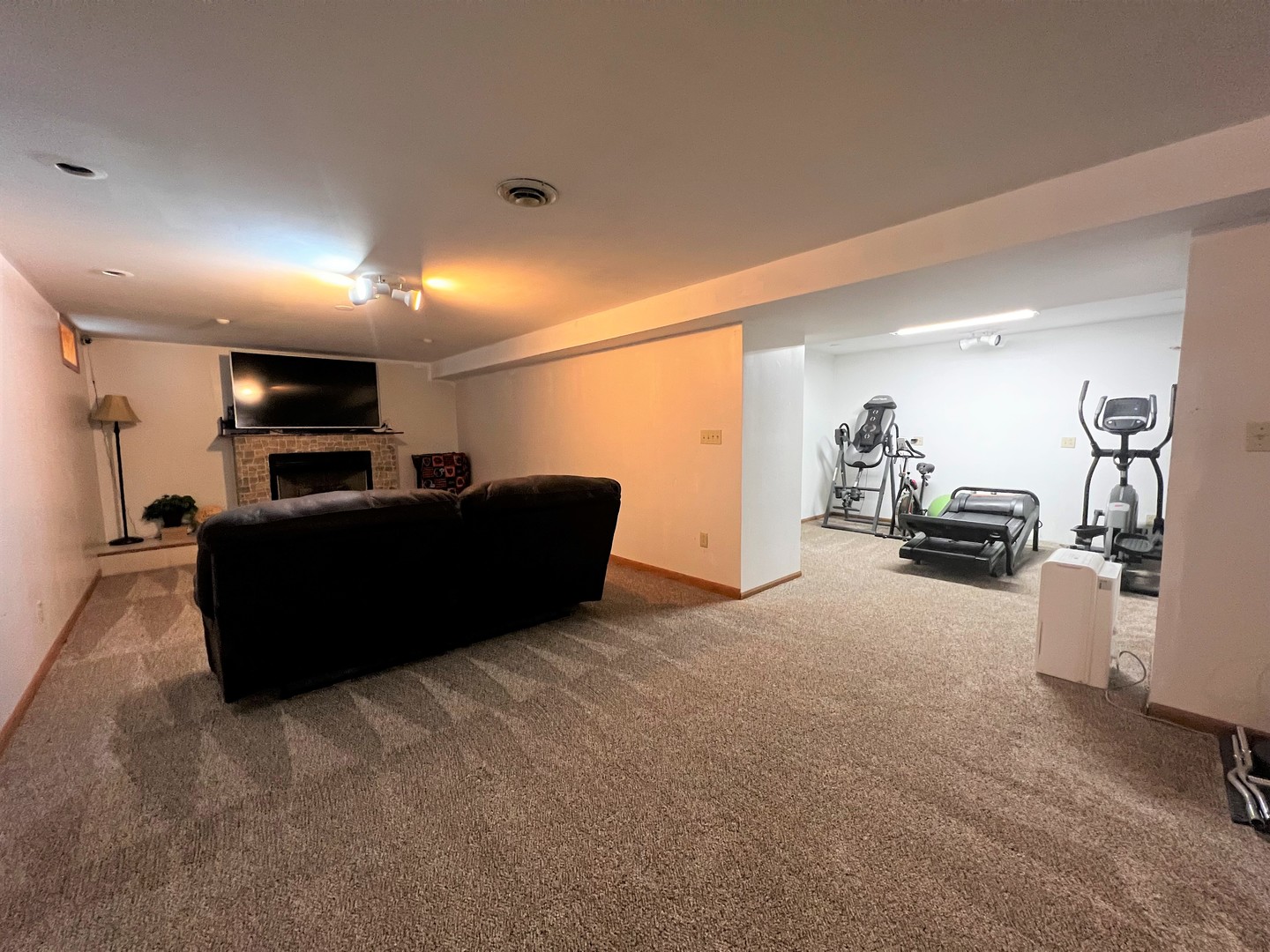 303 Minnesota Drive Dixon, IL 61021 - Photo 27 of 34 a living room with furniture and a flat screen tv