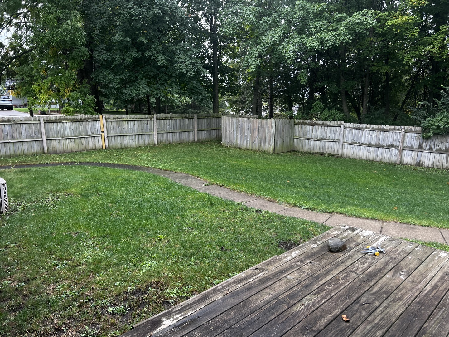 303 Minnesota Drive Dixon, IL 61021 - Photo 33 of 34 a view of a backyard with a wooden fence
