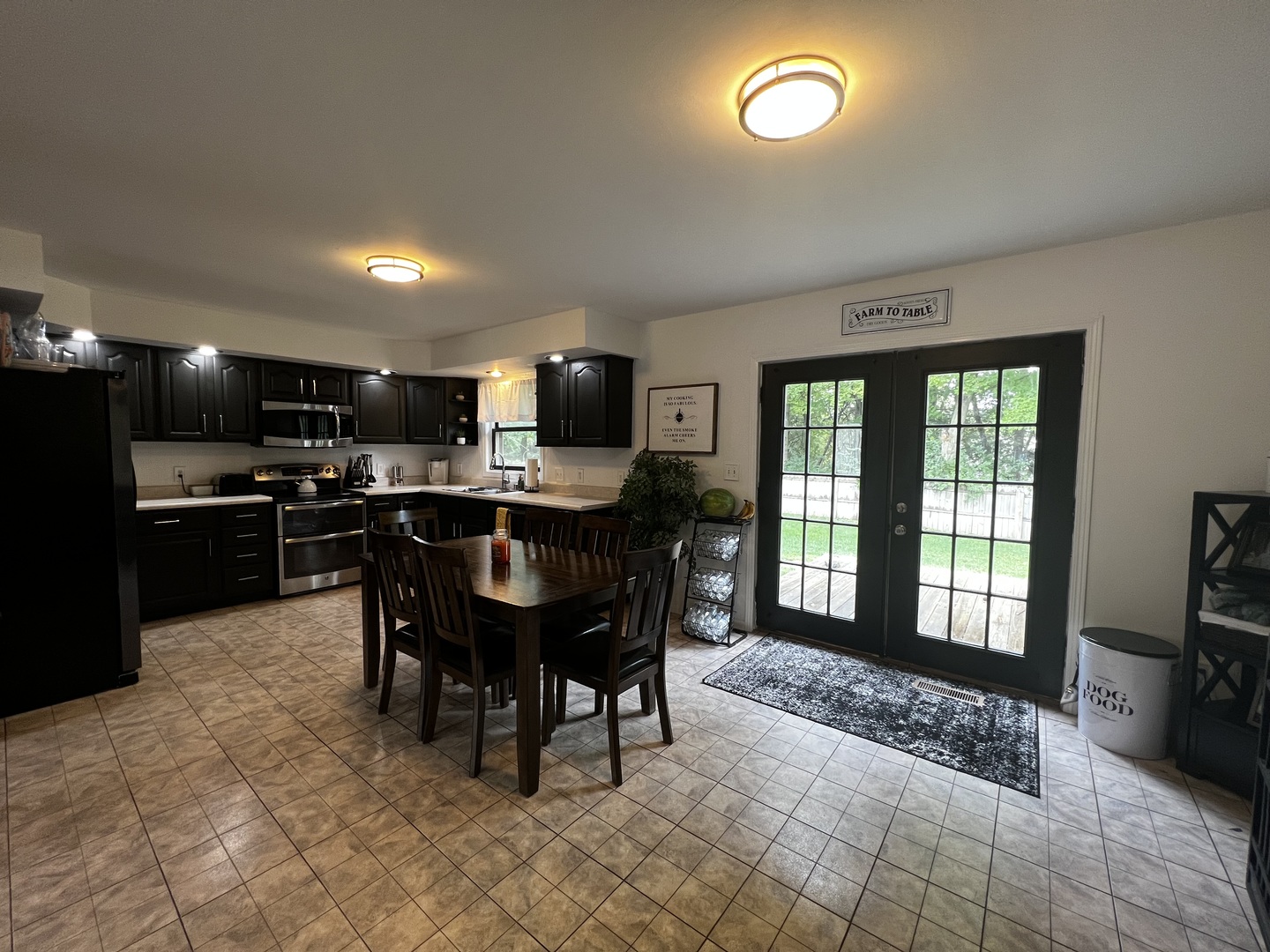 303 Minnesota Drive Dixon, IL 61021 - Photo 10 of 34 a open kitchen with dining room and stainless steel appliances