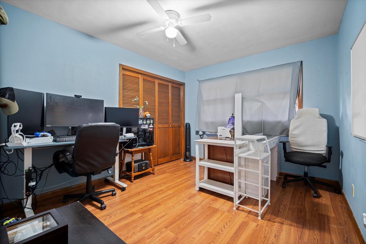306 North Coolidge Street Normal, IL 61761 - Photo 13 of 32 a view of a workspace with furniture and a bedroom