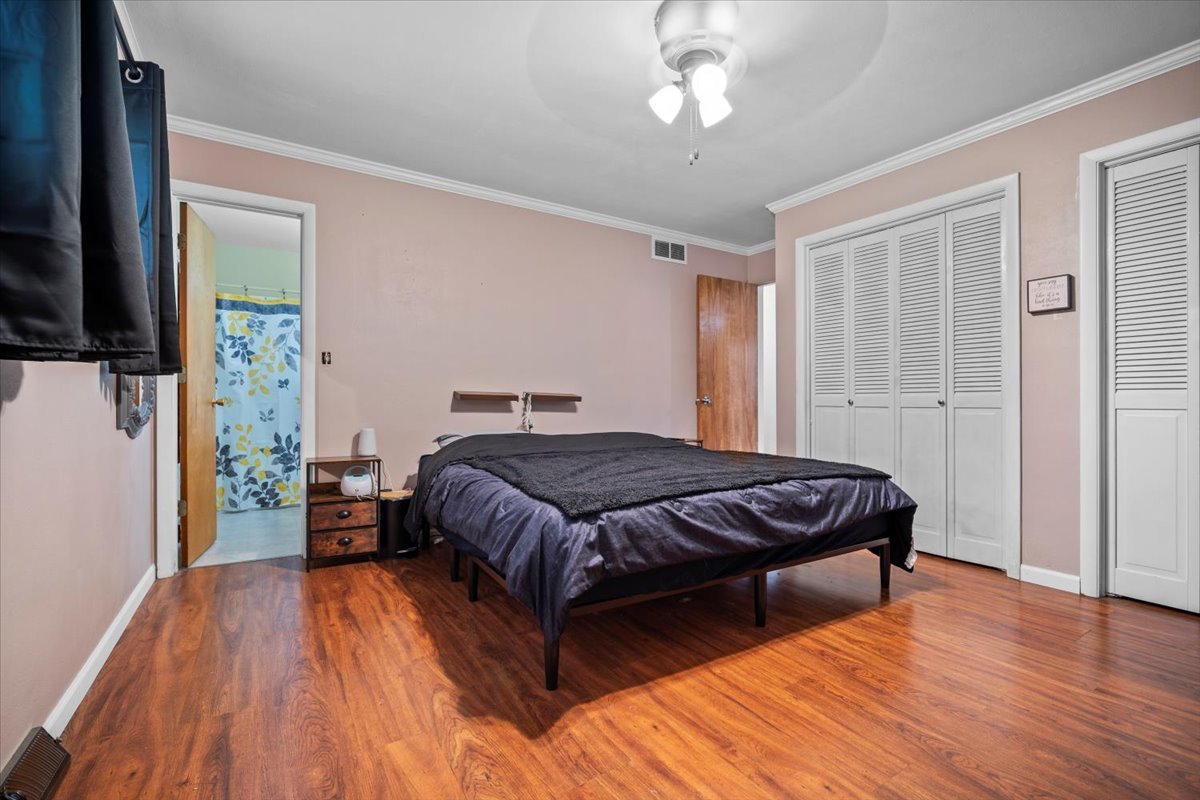 306 North Coolidge Street Normal, IL 61761 - Photo 14 of 32 a spacious bedroom with a bed and a flat screen tv