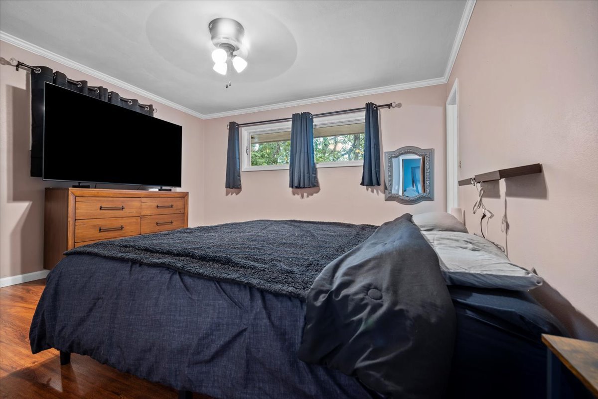 306 North Coolidge Street Normal, IL 61761 - Photo 15 of 32 a bedroom with a bed and a flat screen tv