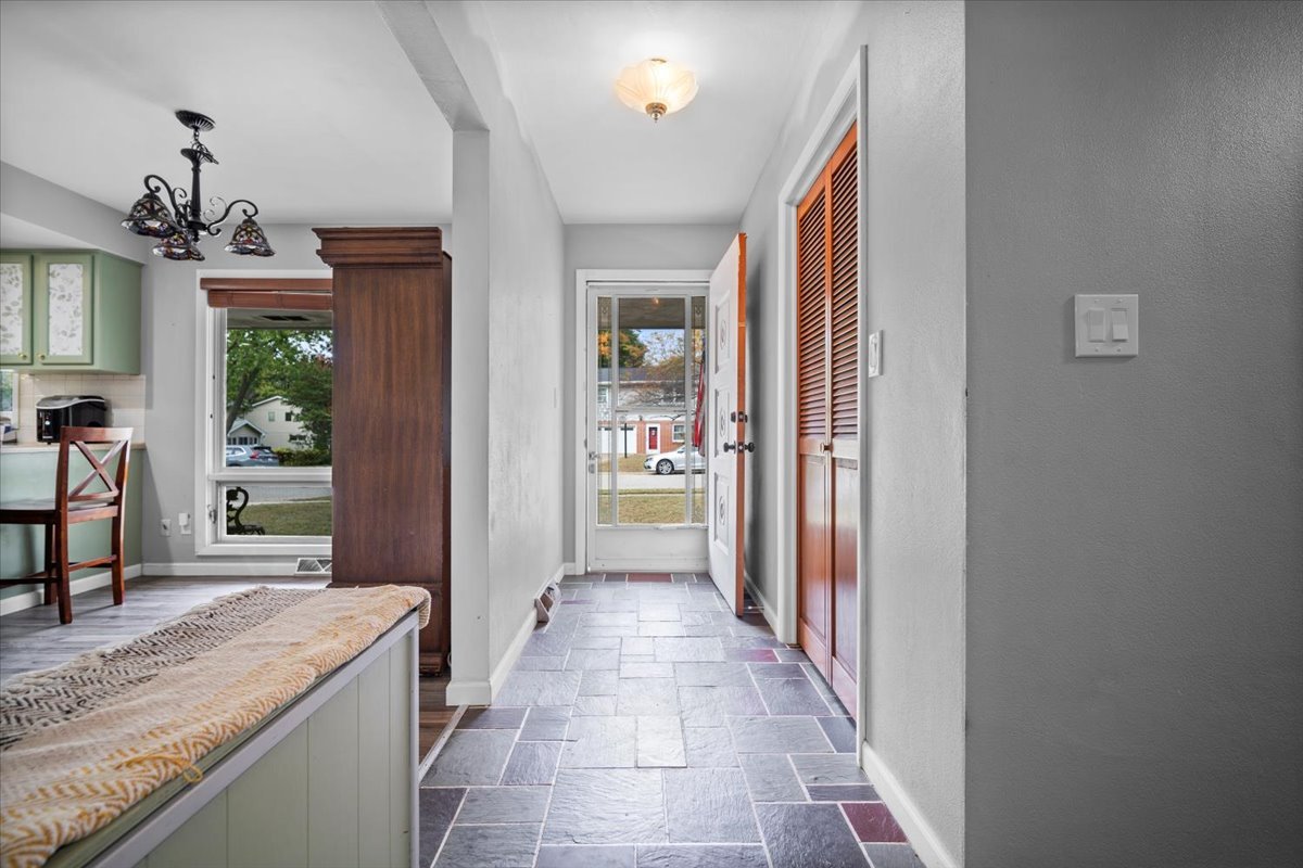 306 North Coolidge Street Normal, IL 61761 - Photo 22 of 32 a hallway with a dining table and chairs