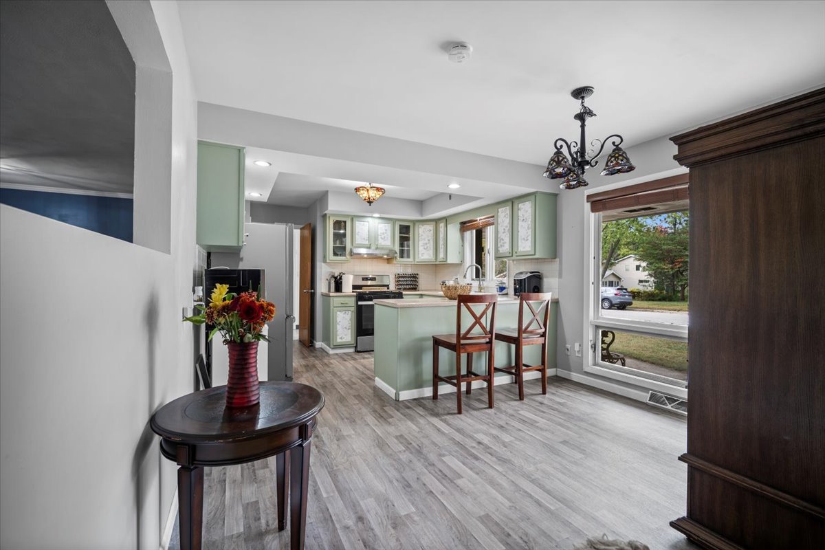 306 North Coolidge Street Normal, IL 61761 - Photo 6 of 32 a view of a dining room with furniture window and wooden floor