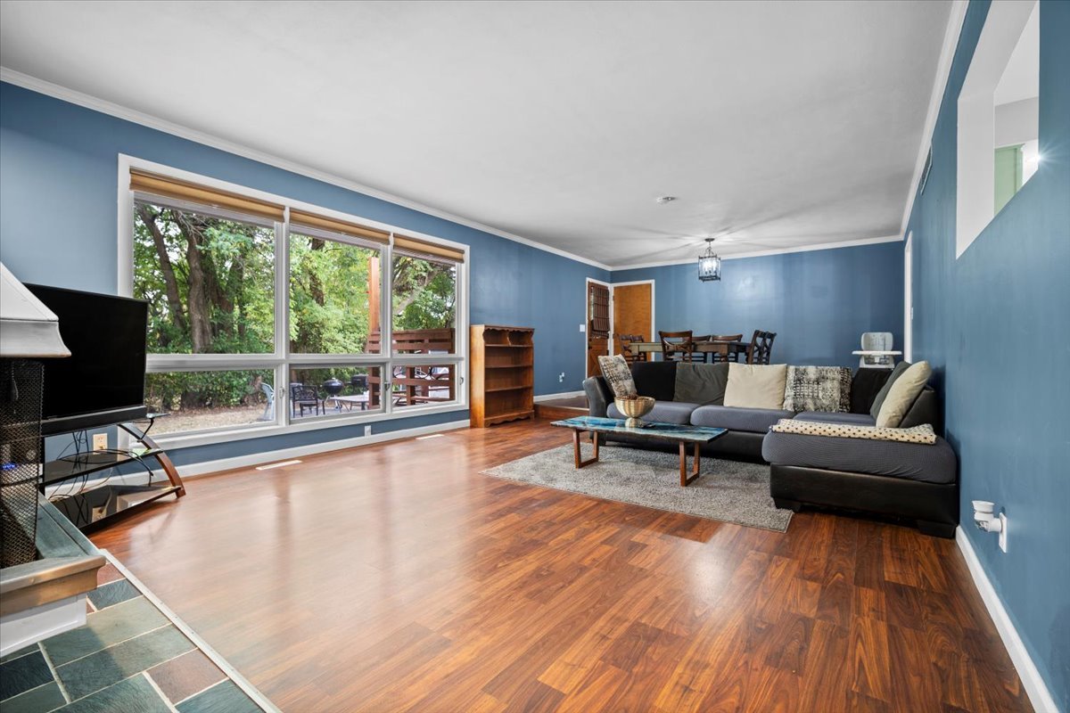 306 North Coolidge Street Normal, IL 61761 - Photo 9 of 32 a living room with furniture and a flat screen tv