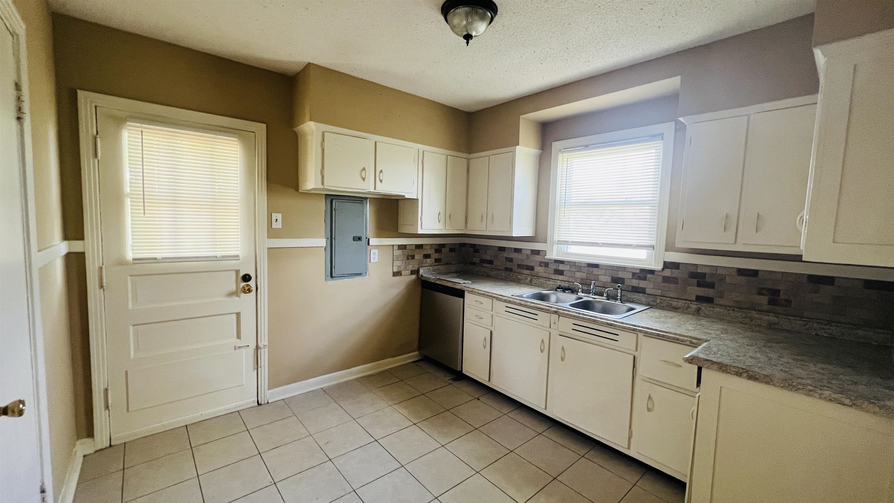 4868 Southern Avenue Memphis, TN 38117 - Photo 12 of 15 a kitchen with white cabinets and sink