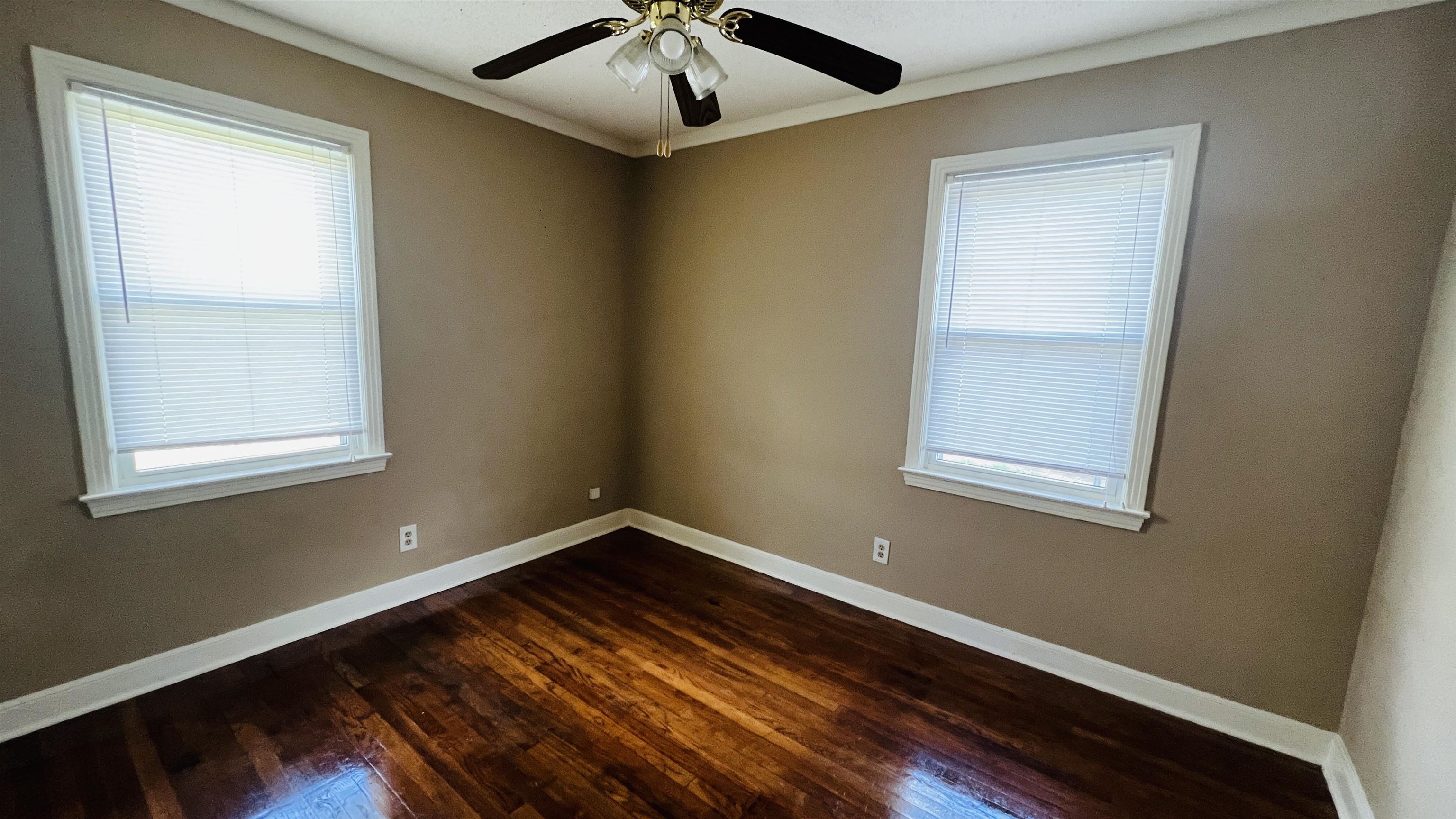 4868 Southern Avenue Memphis, TN 38117 - Photo 10 of 15 a view of room with window and wooden floor