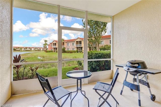 a view of a chairs and table in patio