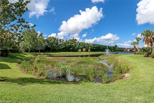 a view of a golf course with a lake