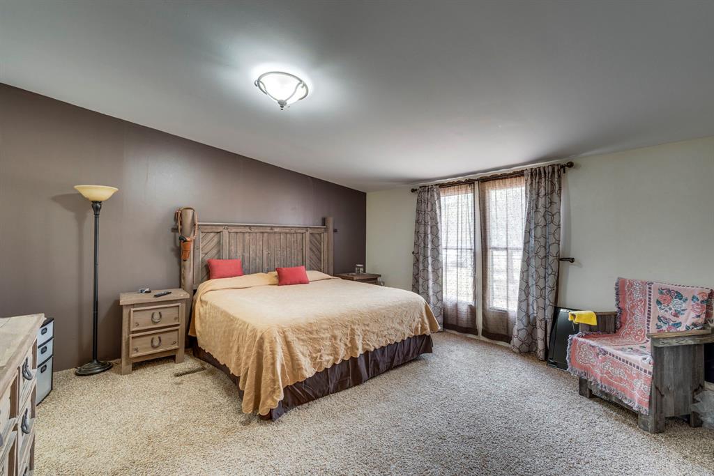 7251 Bennett Lawson Road Mansfield, TX 76063 - Photo 11 of 34 a bedroom with a bed and a night stand