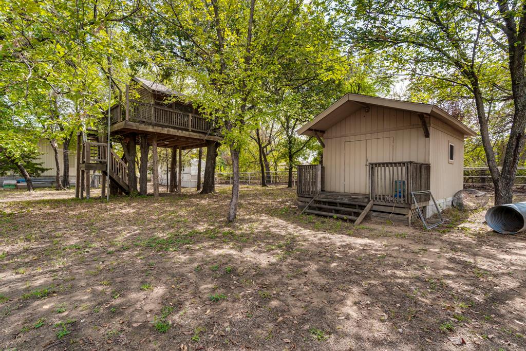 7251 Bennett Lawson Road Mansfield, TX 76063 - Photo 15 of 34 a view of a house with a yard and large tree