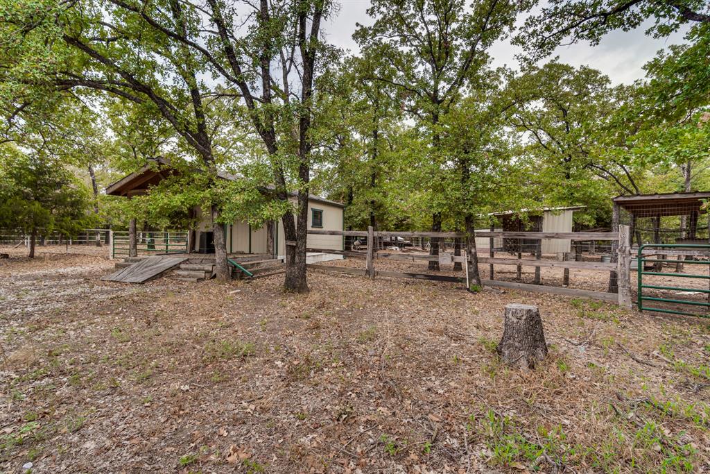 7251 Bennett Lawson Road Mansfield, TX 76063 - Photo 16 of 34 a view of backyard with outdoor seating and green space
