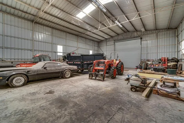 a view of parking garage with cars