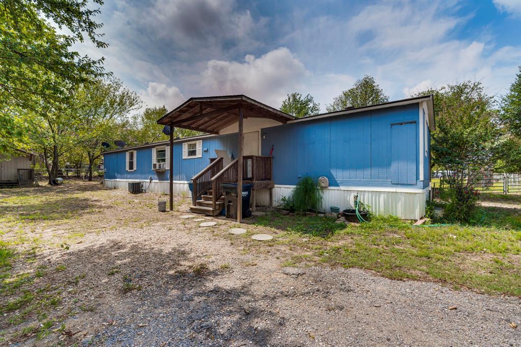 7251 Bennett Lawson Road Mansfield, TX 76063 - Photo 27 of 34 a house view with a backyard space