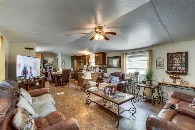 an aerial view of house with yard