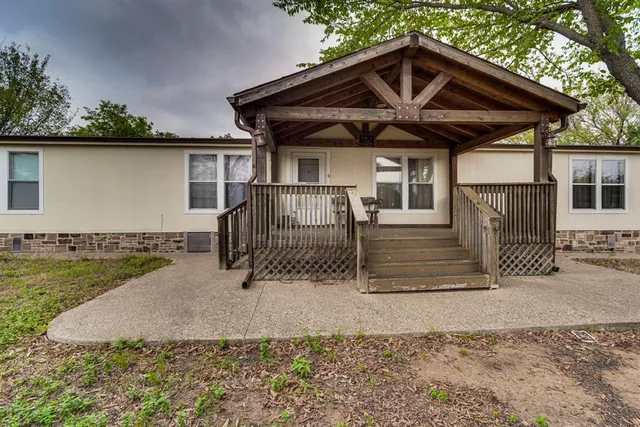 a house with trees in the background