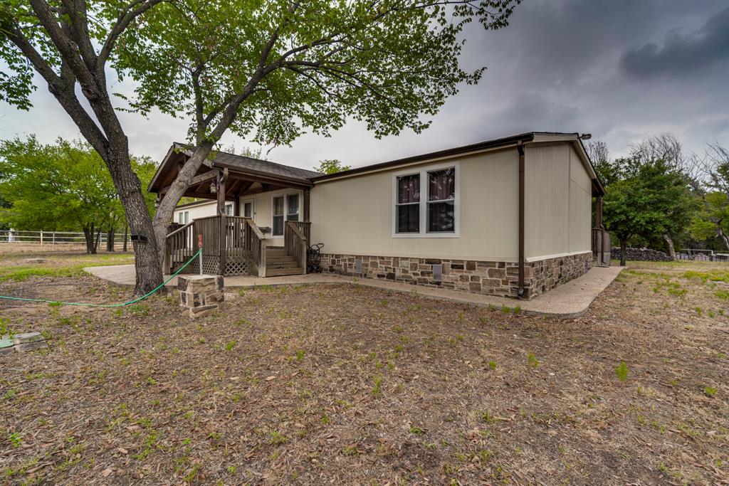 7251 Bennett Lawson Road Mansfield, TX 76063 - Photo 6 of 34 a house with trees in front of it