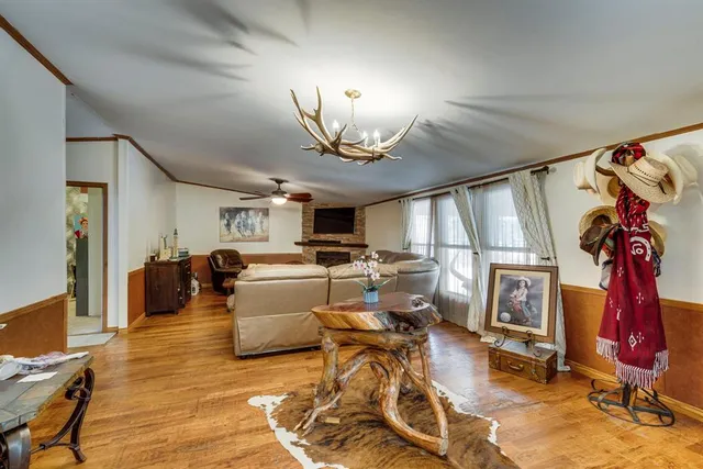 a kitchen with cabinets a counter space stainless steel appliances and wooden floor