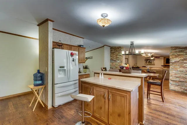 a bedroom with a bed and a night stand