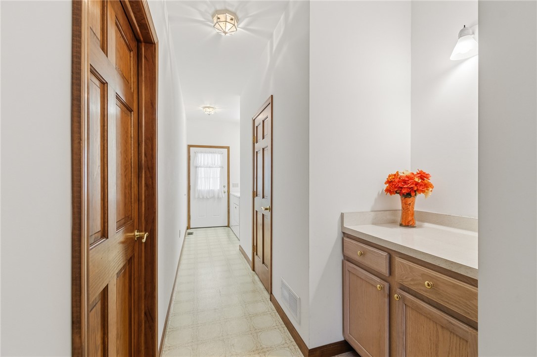 3935 Highway 414 Rose, NY 14433 - Photo 31 of 44 The hall to the HALF BATH and the LAUNDRY ROOM an