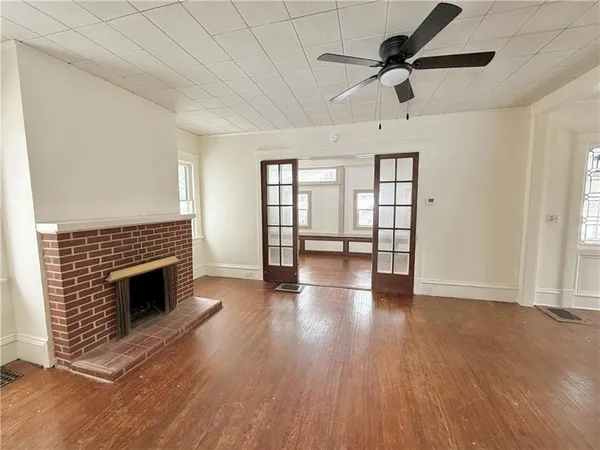 a view of a livingroom with wooden floor