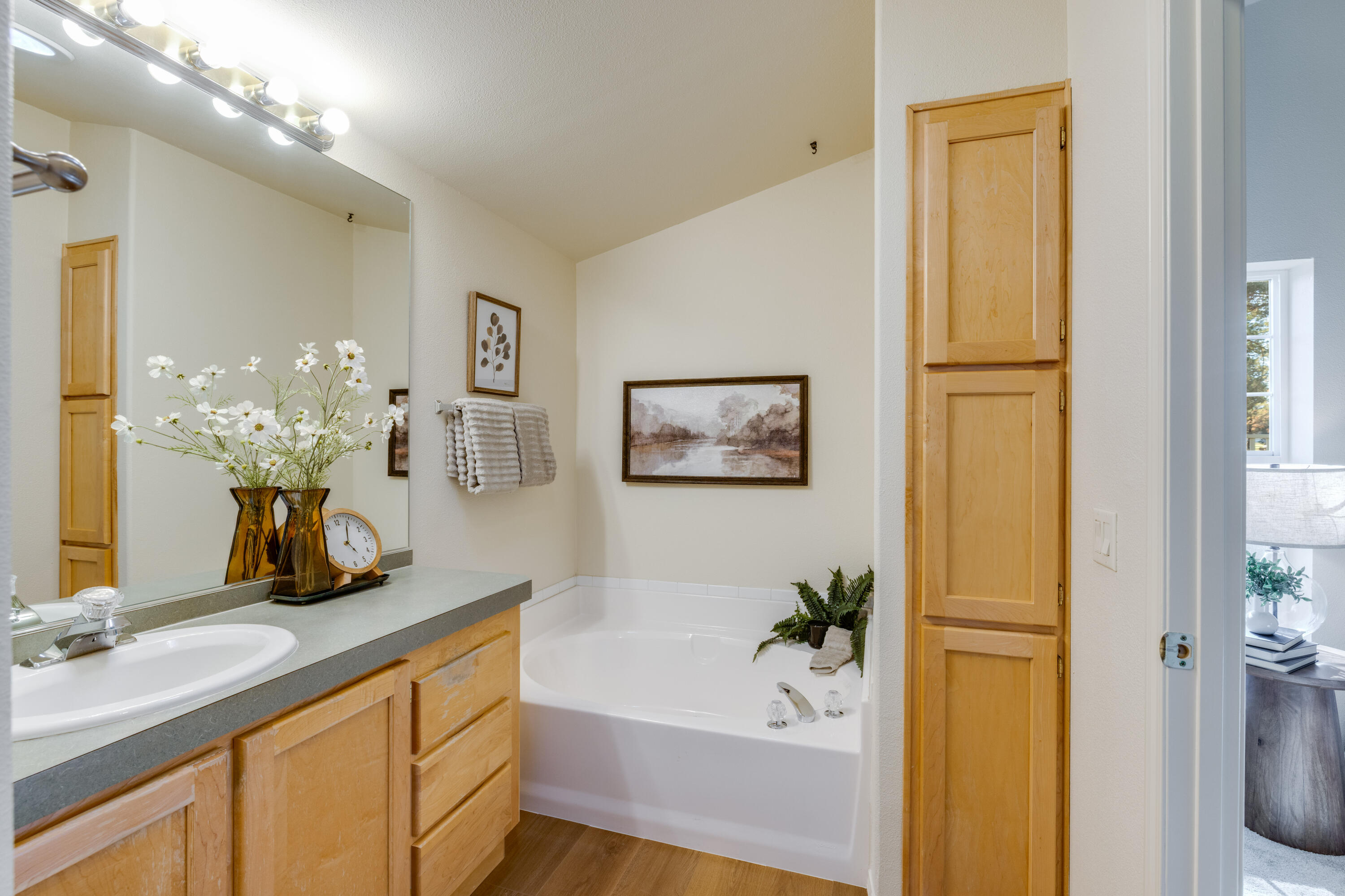 278 North Wheeler Loop Sisters, OR 97759 - Photo 12 of 22 a bathroom with a tub sink and mirror