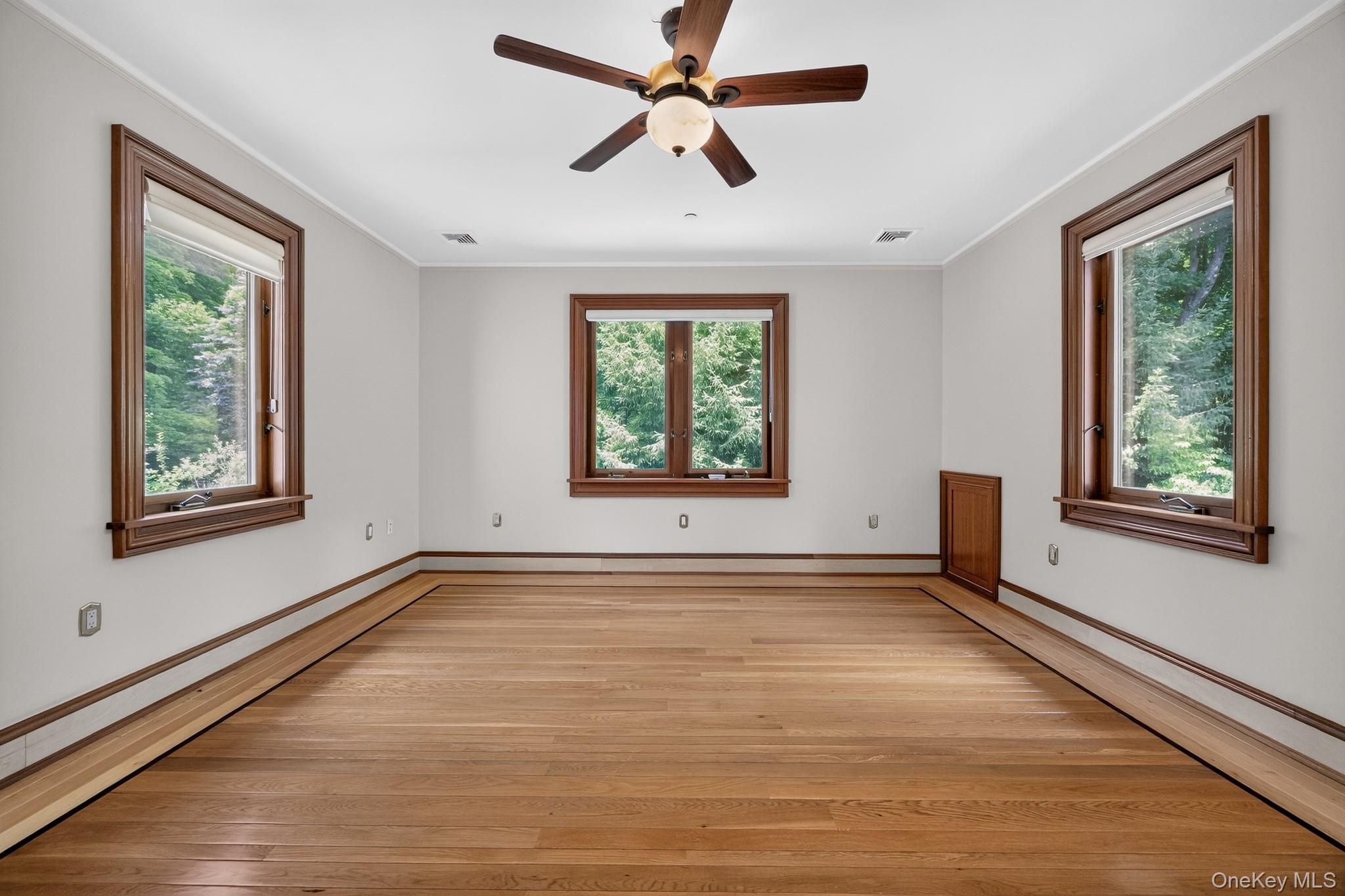 23 Inningwood Road Ossining, NY 10562 - Photo 20 of 50 Spacious room featuring wood-finish flooring, white walls, and a ceiling fan with integrated lighting