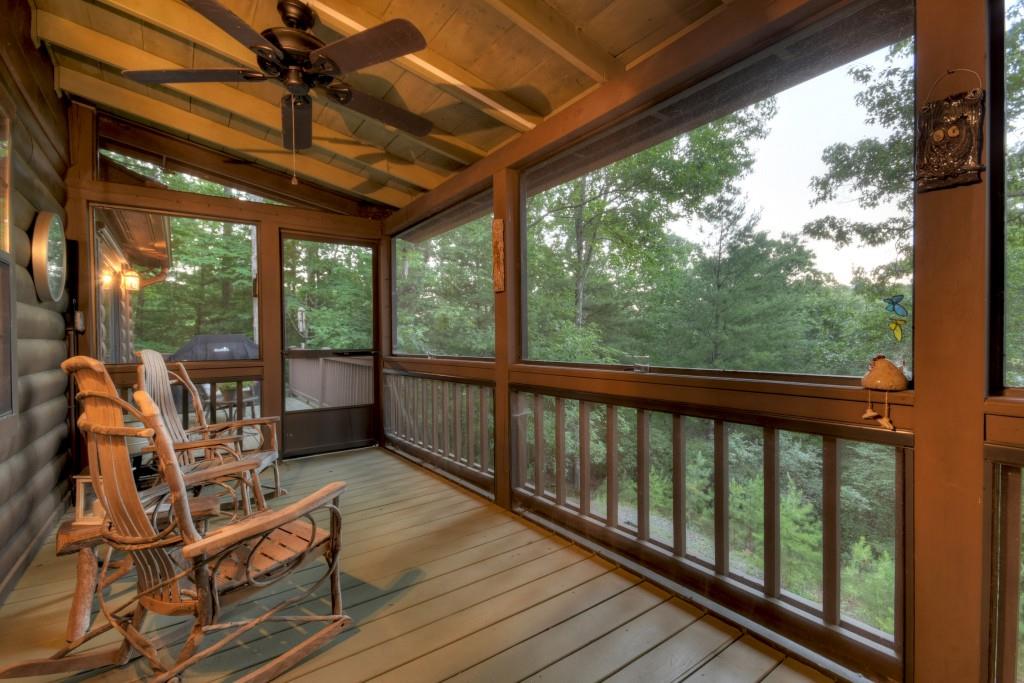 97 Doyle Carder Parkway Blue Ridge, GA 30513 - Photo 23 of 49 a view of a balcony with furniture and wooden floor