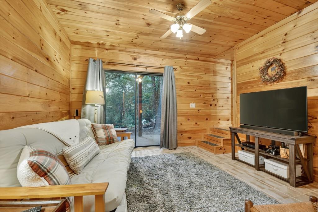97 Doyle Carder Parkway Blue Ridge, GA 30513 - Photo 30 of 49 a living room with furniture and a flat screen tv