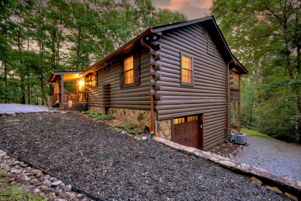 97 Doyle Carder Parkway Blue Ridge, GA 30513 - Photo 3 of 49 a front view of a house with garden
