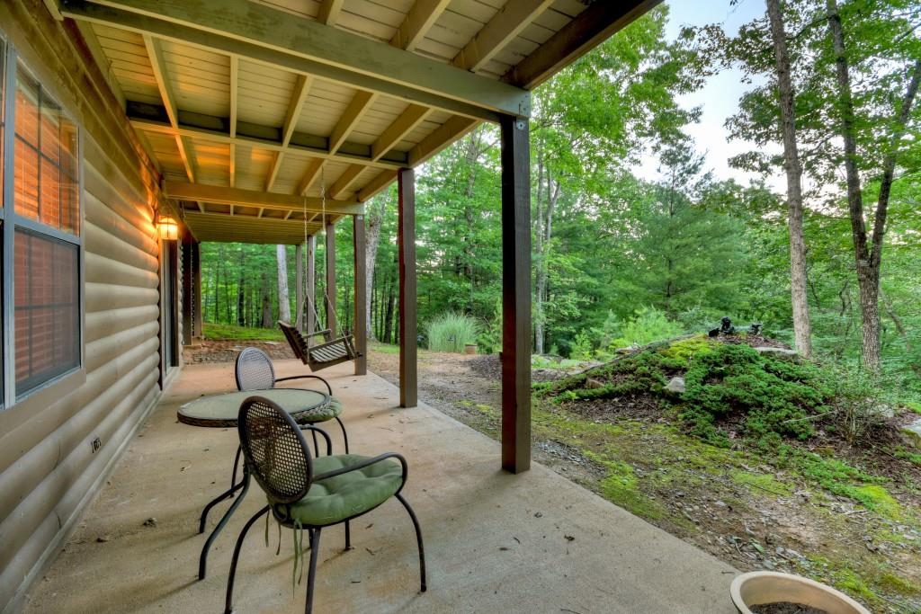 97 Doyle Carder Parkway Blue Ridge, GA 30513 - Photo 35 of 49 a view of a porch with chairs and backyard