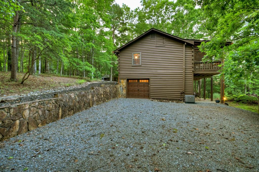 97 Doyle Carder Parkway Blue Ridge, GA 30513 - Photo 41 of 49 a view of a house with a yard and garage