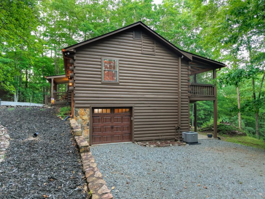 97 Doyle Carder Parkway Blue Ridge, GA 30513 - Photo 45 of 49 a front view of a house with garden