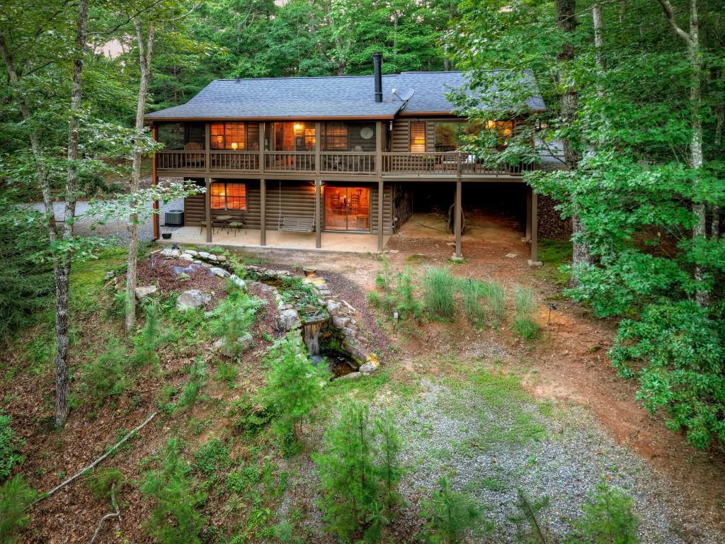 97 Doyle Carder Parkway Blue Ridge, GA 30513 - Photo 46 of 49 front view of a house with a yard