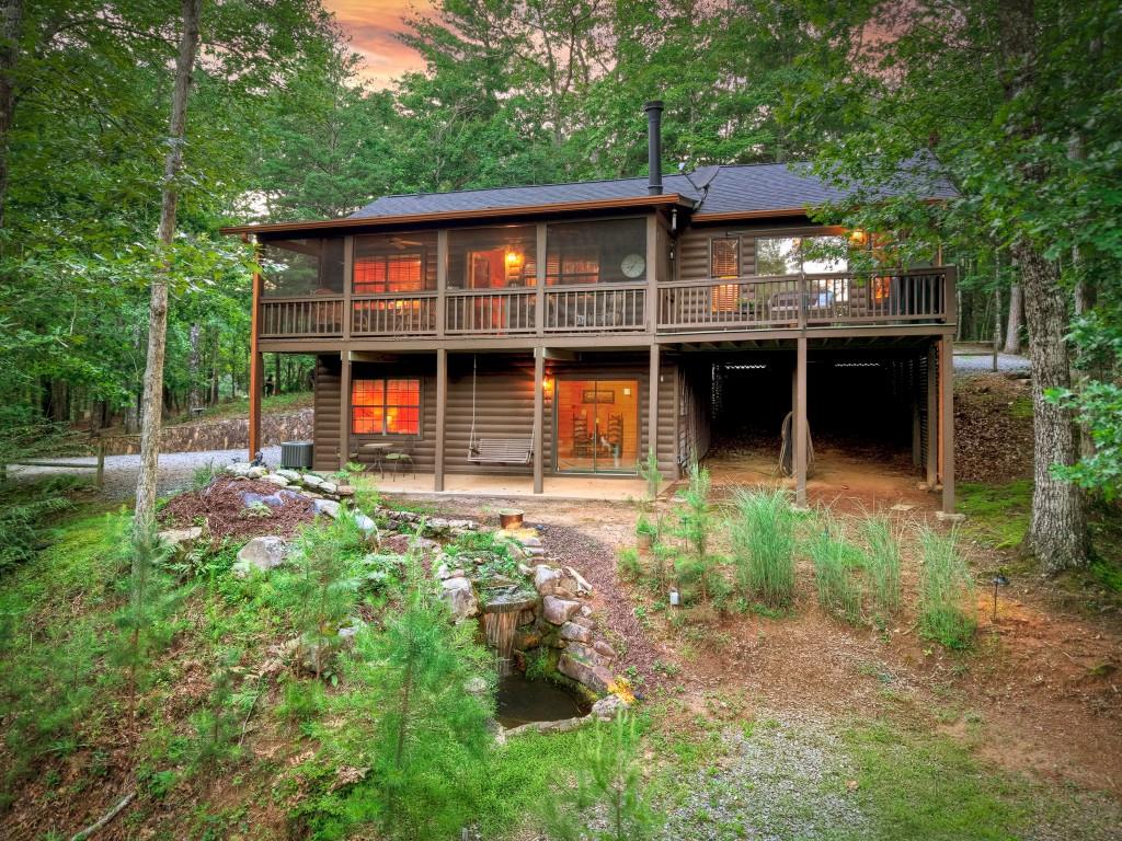97 Doyle Carder Parkway Blue Ridge, GA 30513 - Photo 47 of 49 a front view of a house with garden