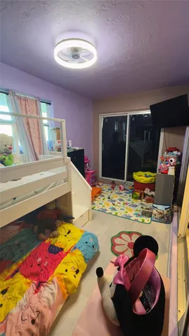 a living room with hard wood flooring and furniture