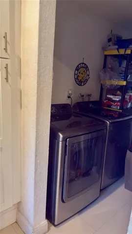 a bathroom with a stove and cabinets