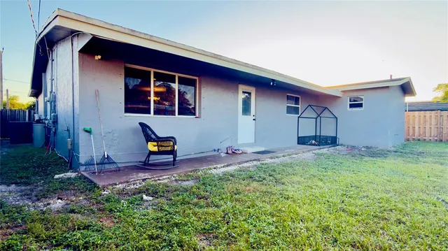 a backyard of a house with seating space