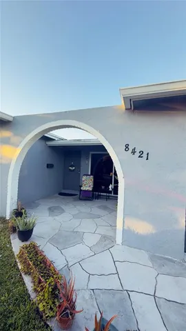 a view of a car in front of a building