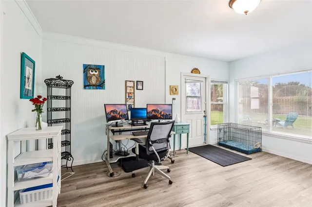 a workspace with furniture hardwood and a window