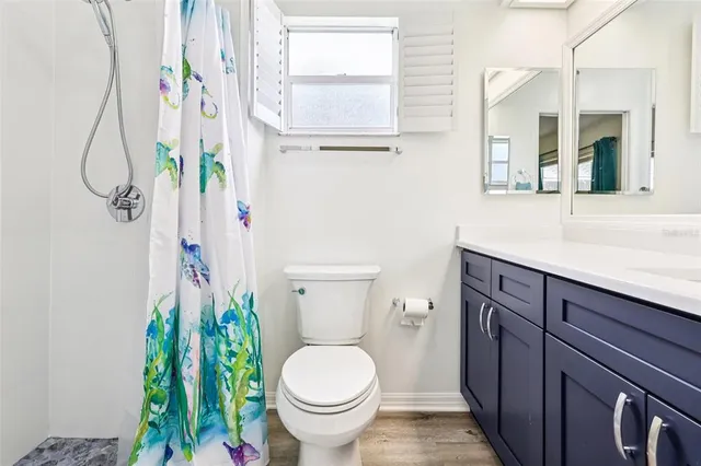 a bathroom with a toilet and a sink