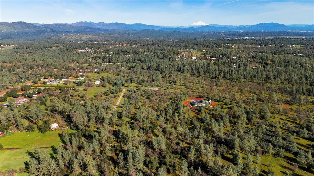 Aegean Way Anderson, CA 96007 - Photo 4 of 12 a view of a lush green hillside and houses