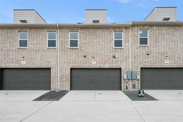 a front view of a house with garage